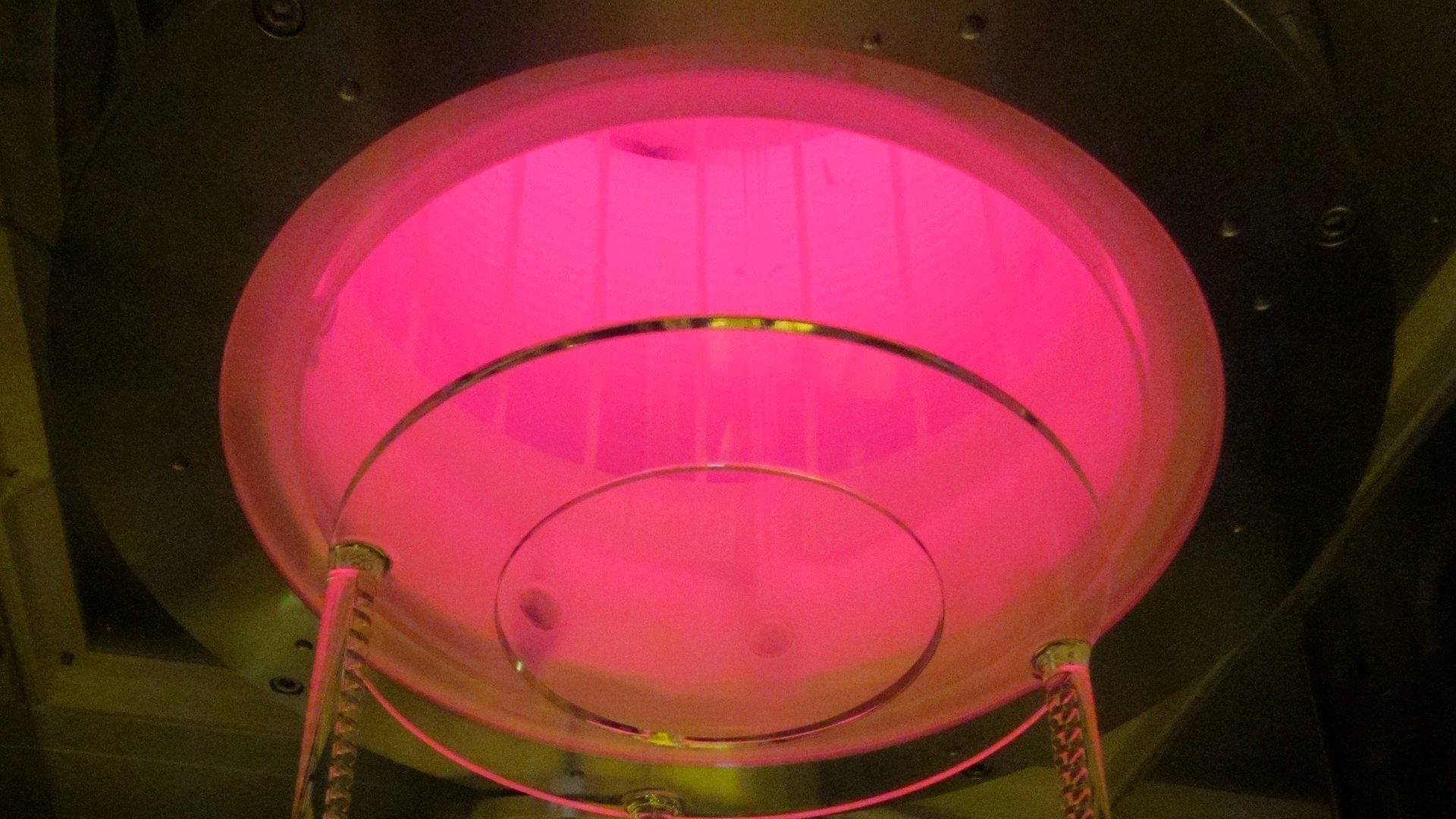 Quartz wafer boat glowing inside a vertical furnace